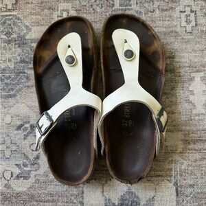 Worn white Birkenstocks